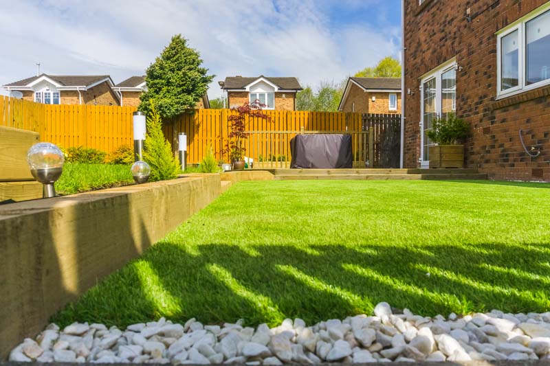 A modern garden with a new planted lawn decking shrubs and borders. Designed and owned by contributor. A good image for Landscape gardiners or designers